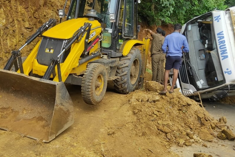 Andhra Police uses JCB to scrape hillside to deblock roadway