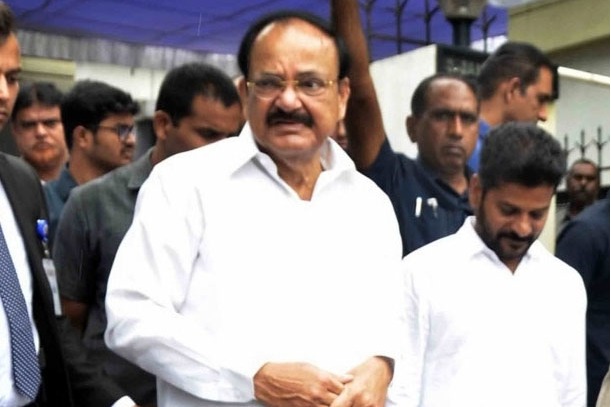 Venkaiah Naidu plays badminton at Chennai sports institute