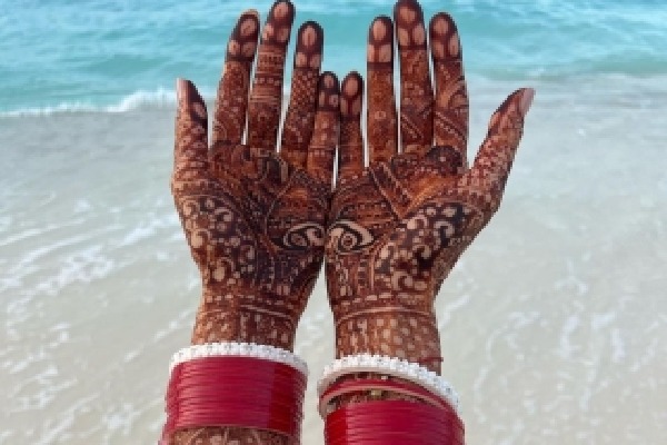 Katrina shares glimpse of beachy honeymoon, shows mehendi adorned hands