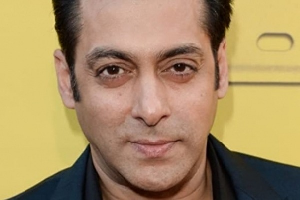 Salman Khan drives an auto-rickshaw on a busy street