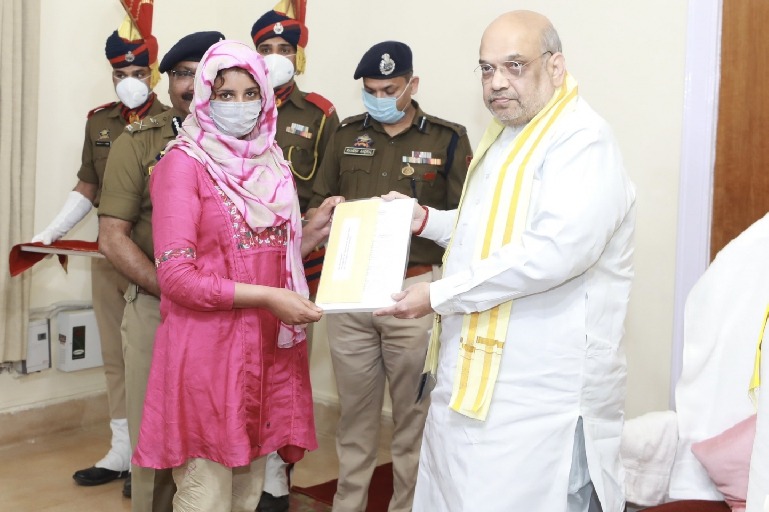 Shah hands over appointment letters to kin of martyred J&K cops