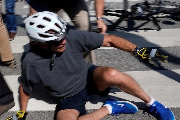 Biden falls down while getting off bike, says 'am fine'