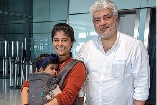 A perfect gentleman: Ajith helps young mum at London airport, carries her bag