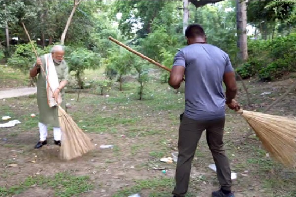 PM participates in cleanliness drive with wrestler Ankit Baiyanpuria