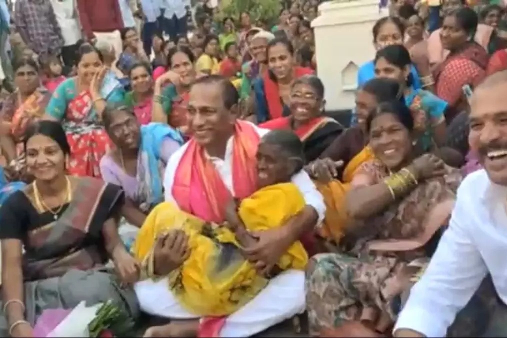 Telangana minister lifts elderly woman in arms during campaign