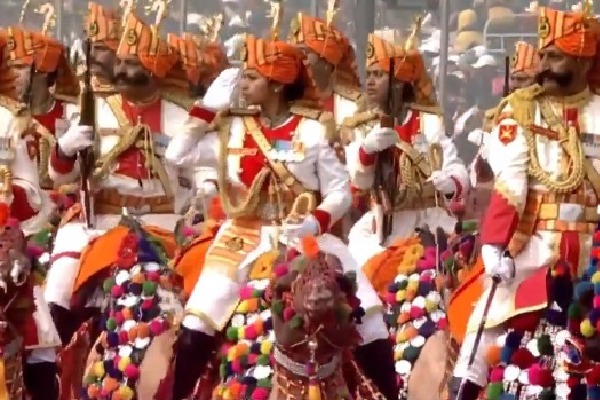 Female riders on decorated camels participate in R-Day parade