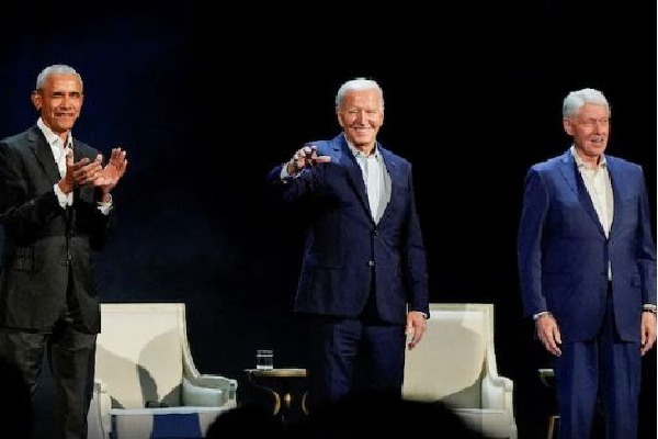 Obama, Clintons praise Biden