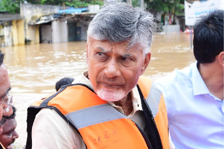 Chandrababu Naidu visits flood-affected Vijayawada in a boat