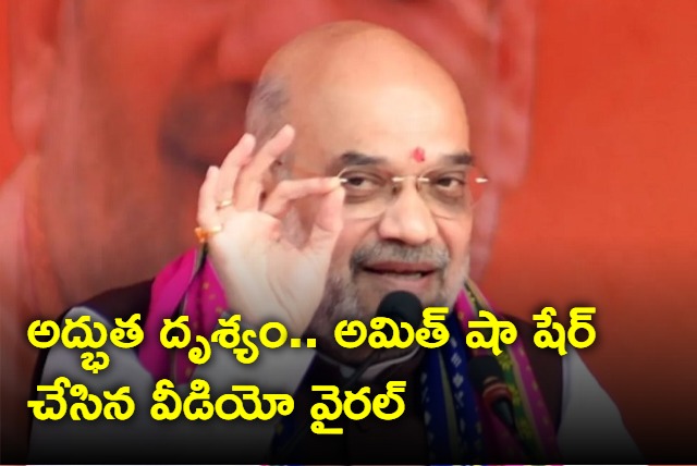 Amit shah shares video of man wiping off rain water on Modi cutout in Karnataka 