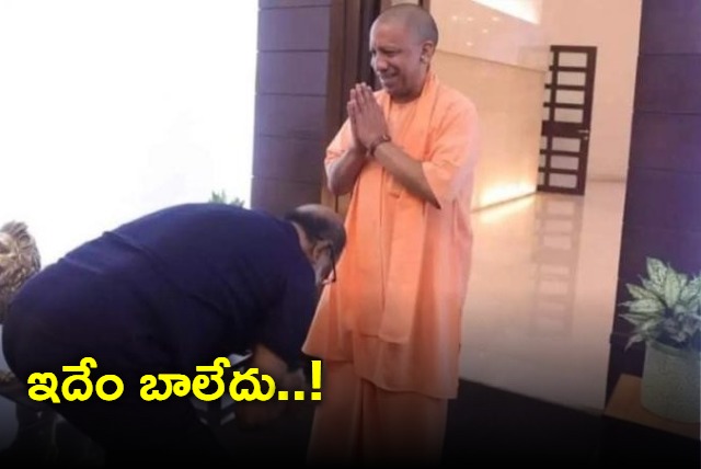 Fans get upset as Rajinikanth touches the feet of UP CM yogi