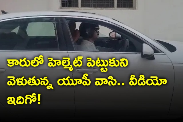 Fined 1000 UP Man Now Drives His Audi With A Helmet On