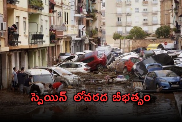 spain searches for bodies after unprecedented flooding claims at least 158 lives